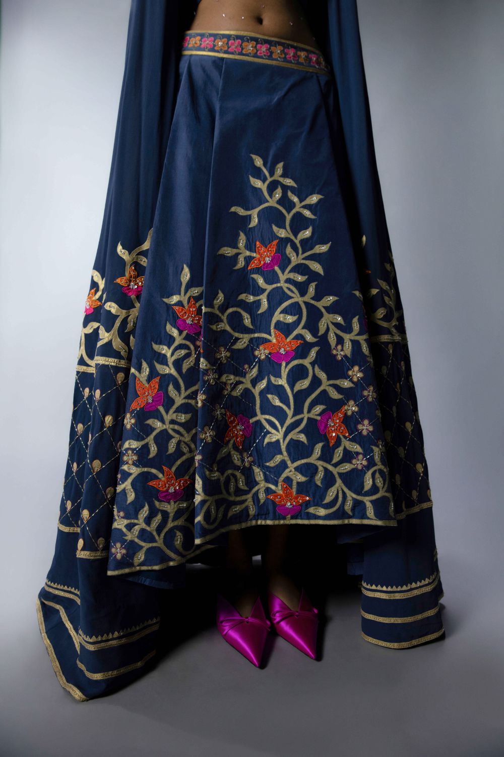 Embroidered Statement Blouse With An Asymmetric Lehenga